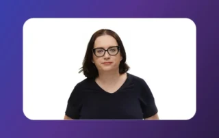 Portrait of a woman with dark hair and glasses, wearing a black top, centered inside a white rounded-rectangle frame on a purple gradient background.