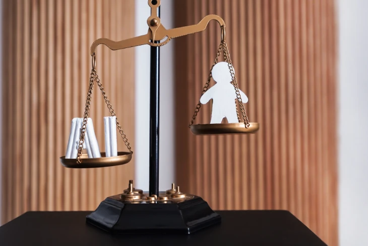 Symbolic balance scale illustrating AI Act transparency guidelines and human rights